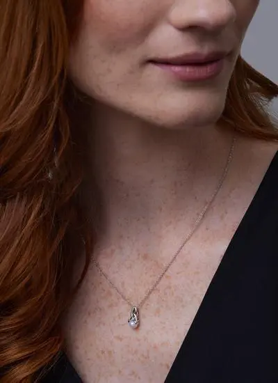 Close up shot of red haired model wearing Sterling Silver Trinity Pearl Pendant